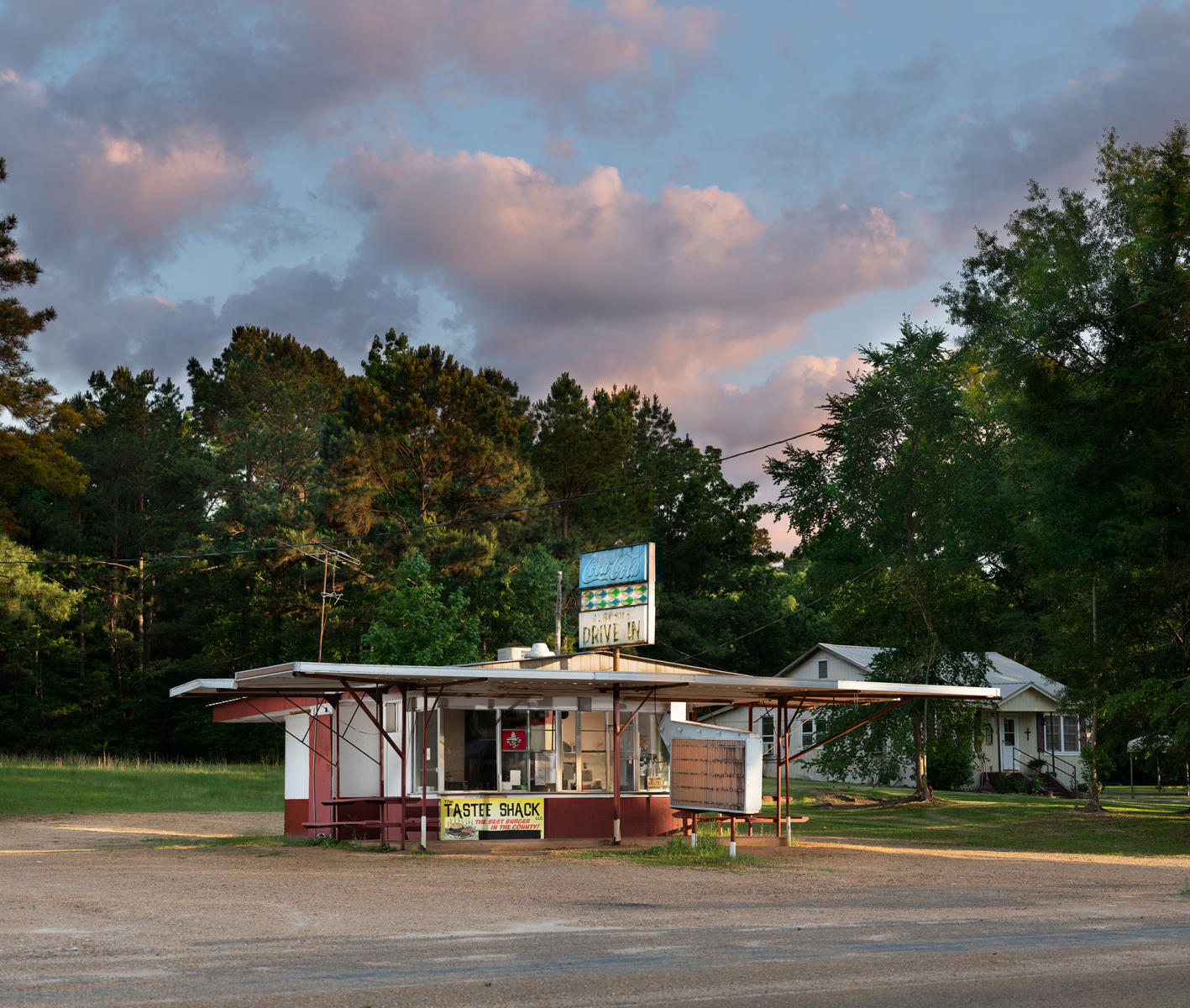 <div class="storycaption">
	<div class="galleryIntroTextArea holder">
		<div class="galleryIntroTextContent">
			<div class="galleryIntroTextContentInside">
				<div class="frishhead">
					ABDUCTION SITE 
				</div>
				<div class="frishsubhead">
					MEADVILLE, MISSISSIPPI 
				</div>
				<div class="frishtext">
					On May 2, 1964, Charles Eddie Moore, a college student, and Henry Hezekiah Dee, a millworker, both 19 and from Franklin County, Mississippi, were picked up by KKK members while hitchhiking from this Meadville drive-in, at the time known as Tastee Treat. They were abducted, interrogated and tortured in a nearby forest, locked in a trunk of a car, driven across state lines, chained to a Jeep motor block and train rails, and dropped alive into the Mississippi River to die. Moore's and Dee's mangled torsos were discovered on July 12 and 13, 1964 during the frantic FBI search for James Chaney, Andrew Goodman, and Michael Schwerner, the three civil rights workers who disappeared on June 21. When it was discovered that the bodies were those of two black men and not those of the civil rights workers, two of whom were white, media interest evaporated and the press moved on. While the FBI investigated the case and arrested two suspects in November 1964, the district attorney concluded there was insufficient evidence for prosecution. The case was dropped by local authorities, some of whom were complicit in the crime, according to FBI and HUAC documents. In January 2007 the murderer, James Ford Seale, was arrested. 
				</div>
				<div class="frishdate">
					PHOTOGRAPHED: 2019 
				</div>
			</div>
		</div>
	</div>
</div> : IMAGES : Ghosts of Segregation